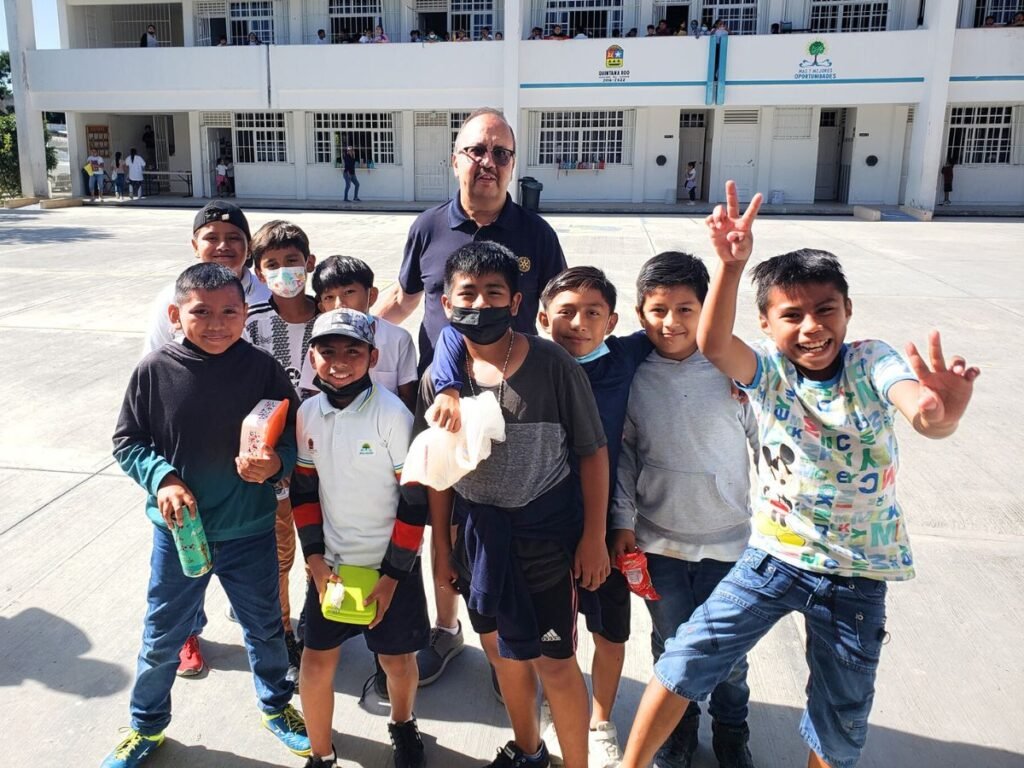 Roger Mann and students at the Cristo Rey Primary School